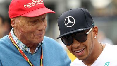 Niki Lauda, left, part of the senior management at Mercedes-GP, plans to hold talks with Lewis Hamilton, right, and Nico Rosberg. Jean Christophe Magnenet / AFP