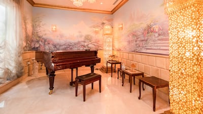 A music room with ornate wallpaper. Photo: Engel and Voelkers