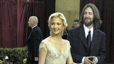 2003: Kate Hudson wears Versace as she arrives for the 75th Annual Academy Awards with then-husband Chris Robinson. Reuters