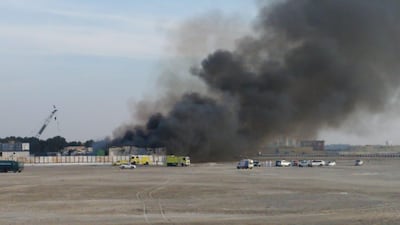 Smoke billows from a fire at a work site in south Reem Island, Abu Dhabi. The National