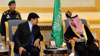 Venezuela'a President Nicolas Maduro, left, arrives in Riyadh on January 25, 2015 to meet the governor of the Riyadh province, Turki bin Abdullah Al Saud, right, and offer his country's condolences for Saudi King Abdullah, who died early Friday at age 90. Saudi Press Agency/AP Photo