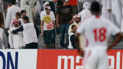 Police calm supporters after North Korea scored their second goal during Saturday's World Cup Qualifier.