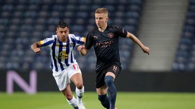 Manchester City's Oleksandr Zinchenko runs with the ball away from Porto's Jesus Corona, left, during the Champions League group C soccer match between FC Porto and Manchester City at the Dragao stadium in Porto, Portugal, Tuesday, December 1, 2020. AP Photo