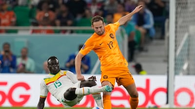 Daley Blind of the Netherlands, left, is challenged by Senegal's Krepin Diatta. AP