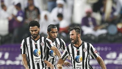 Mirko Vucinic, right, of Al Jazira celebrates scoring during the Arabian Gulf League match against Al Ain at Mohammad bin Zayed Stadium on October 5, 2014. Courtesy Al Ittihad