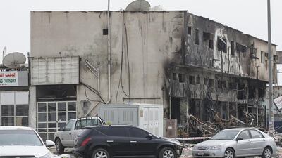The remains of the Mussaffah warehouse which caught fire while 100 workers were sleeping. Eleven of them died. Mona Al Marzooqi/ The National
