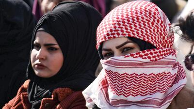 Protesters gather during an anti-government sit-in outside the gate of Kufa University. AFP