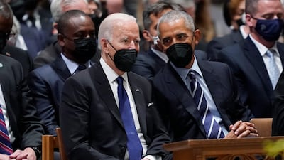 President Joe Biden and former president Barack Obama speak before the service. AP
