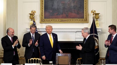 US President Donald Trump is applauded at the White House Crypto Summit at the White House. Reuters