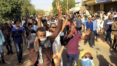 Sudanese demonstrators chant slogans as they march along the street during anti-government protests in Khartoum, Sudan December 25, 2018. Reuters