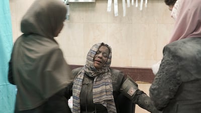 Palestinians wounded in Israel's bombardment wait for treatment at a hospital in Deir Al Balah, south of the Gaza Strip, on Tuesday. AP