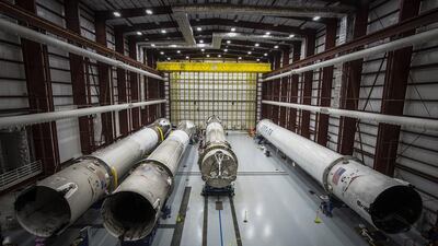 Recovered SpaceX Falcon rocket boosters in a hangar at the Kennedy Space Center, Florida. The company has signed its first customer for one of its used rockets. Courtesy : SpaceX