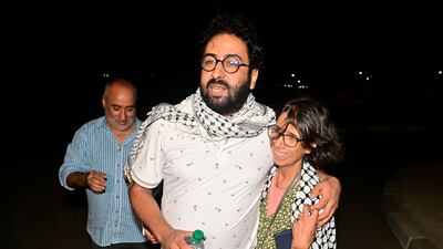 Moroccan journalist Omar Radi walks with his mother after leaving prison in Tiflet, Morocco. EPA