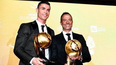 Juventus' Portuguese forward Cristiano Ronaldo (L), holding his "Best Player of the Year 2018 Award" and Portuguese football agent Jorge Mendes, holding his "Best Agent of the Year 2018 Award" pose during the 10th edition of the Dubai Globe Soccer Awards in Dubai. AFP