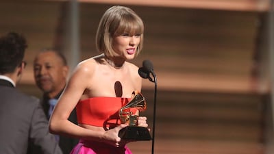 Taylor Swift accepts the award for album of the year for 1989 at the 58th annual Grammy Awards. Matt Sayles / Invision / AP