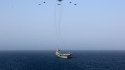 The Abraham Lincoln Carrier Strike Group and a US Air Force B-52H Stratofortress, assigned to the 20th Expeditionary Bomb Squadron and part of the Bomber Task Force deployed to the region, conducting joint exercises in the US Central Command area of responsibility, in the Arabian Sea. EPA