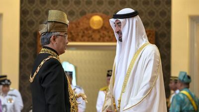 HH Sheikh Mohamed bin Zayed Al Nahyan, Crown Prince of Abu Dhabi and Deputy Supreme Commander of the UAE Armed Forces (R) speaks with HM King Abdullah Ri’ayatuddin Al-Mustafa Billah Shah of Malaysia (L), during the King's inauguration ceremony, at Istana Negara, the National Palace of Malaysia. Ministry of Presidential Affairs ---