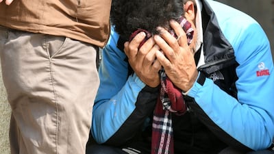 Family members of plane crash victims react outside a morgue at the Teaching Hospital in Kathmandu on March 13, 2018, a day after the deadly crash of a US-Bangla Airlines plane at the international airport. Prakash Mathema / AFP