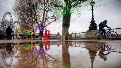 A man cycles walks along a deserted Southbank in central London. AP Photo