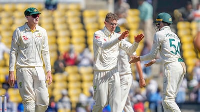 Australia's Todd Murphy, centre, picked up seven wickets on debut. AP