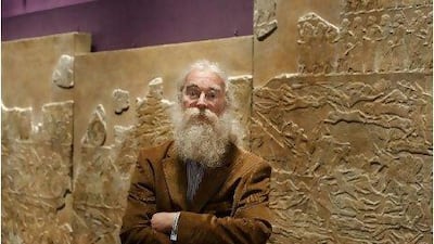 Dr Irving Finkel, the curator of the Middle East Department - the British Museum, with some of the artefacts featuring cuneiform: the oldest form of writing yet discovered.