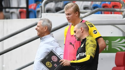 Dortmund's Erling Haaland, centre, waits for substitution on Saturday. AP