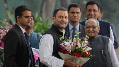 Senior Congress party leaders welcome their vice-president, Rahul Gandhi (second left) with flowers as he arrives to file his nomination papers at party headquarters in New Delhi on December 4, 2017. Manish Swarup / AP