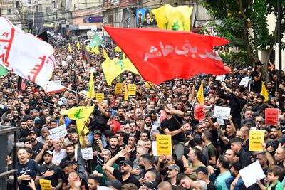 Supporters of the Lebanese Shiite Islamist party and militant group Hezbollah shout religious slogans during the funeral of Hezbollah fighter Ahmed Qassas in a southern suburb of Beirut, Lebanon on August 10. EPA
