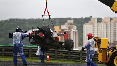 Romain Grosjean’s Haas car is removed from the track after crashing on the parade lap. Clive Mason / Getty Images
