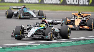Mercedes driver Lewis Hamilton leads McLaren's Lando Norris and Mercedes teammate George Russell. PA