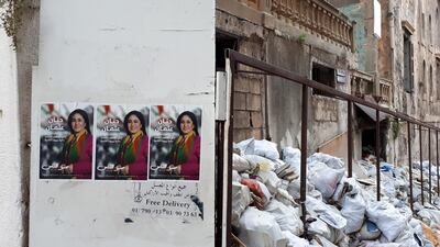 Posters hang on the walls amid the rubbish in Basta, Beirut India Stoughton