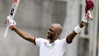 West Indies' Roston Chase celebrates his century against India on Day 5 of the second Test in Jamaica on Wednesday. Ricardo Mazalan / AP Photo / August 3, 2016