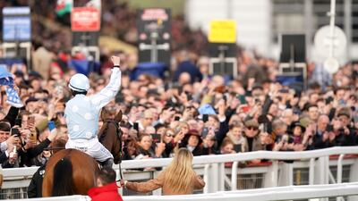 Jockey Rachael Blackmore riding Honeysuckle gestures to the crowd after winning the Champion Hurdle during day one of the Cheltenham Festival. PA