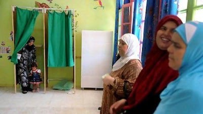 Voters prepare to cast their ballots at a polling station in Algiers today. Voting began across Algeria in the country's first polls since the Arab Spring swept the region, with the ruling party, its Islamist allies, and a boycott movement all hoping for victory.