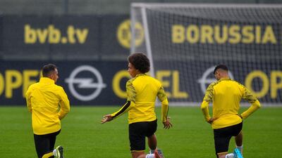 Dortmund's players including Belgian midfielder Axel Witsel (C) take part in a trainning session on the eve of the UEFA Champions League Group F football match between Borussia Dortmund and Barcelona in Dortmund, western Germany, on September 16, 2019. / AFP / SASCHA SCHUERMANN