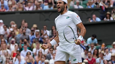 Italy's Matteo Berrettini celebrates after defeating Poland's Hubert Hurkacz during the men's singles semifinals match on day eleven of the Wimbledon Tennis Championships in London, Friday, July 9, 2021. (AP Photo / Alberto Pezzali)
