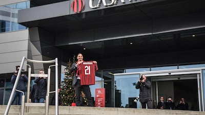Zlatan Ibrahimovic poses with his jersey . EPA