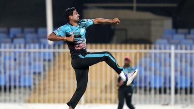 Marine's Rahul Sharma takes the wicket of Bukhatir's Sultan Ahmed in the Bukhatir League final in Sharjah. Chris Whiteoak / The National