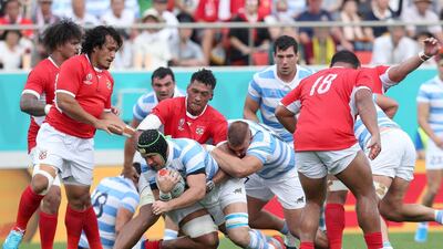 Matias Alemanno of Argentina (C) in action against Tonga players during the Rugby World Cup match between Argentina and Tonga at Hanzono Stadium in Higashiosaka, Japan. EPA