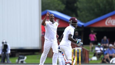 South African paceman Vernon Philander, centre, celebrates after taking the wicket of West Indies batsman Jermaine Blackwodd in the first Test at Centurion. Gianluigi Guercia / AFP