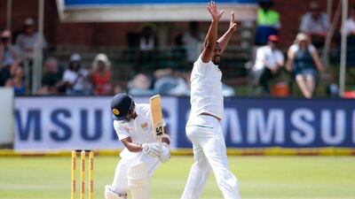 South African bowler Vernon Philander, right, celebrates the dismissal of Sri Lanka's Dinesh Chandimal, left, during the second day of the first cricket Test match between South Africa and Sri Lanka on December 27, 2016 at the Port Elizabeth cricket ground in Port Elizabeth, South Africa. Gianluigi Guercia / AFP