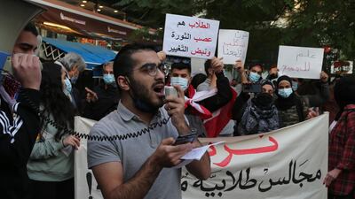 Students from different universities carry placards, wave Lebanese flags during a demonstration under the slogan of 'A Day of Student Rage' in Al-Hamra, Beirut. EPA