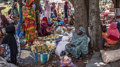 Shoppers at a market near the Ura Refugee Site in Ethiopia's Benishangul-Gumuz region. AFP