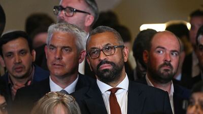 UK Environment, Food and Rural Affairs Secretary Steve Barclay and Home Secretary James Cleverly listen to Mr Sunak's speech. AFP