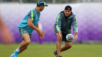 Australia head coach Michael Cheika passes to Nic White during a training session at the 2019 Rugby World Cup in Japan. Getty Images