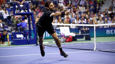 Roger Federer stretches to keep the ball alive. AFP
