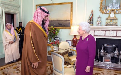 Queen Elizabeth II greets Prince Mohammed bin Salman during his 2018 visit to Britain. He has been invited to the UK for another visit later this year, sources have told The National. Getty Images