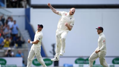 Ben Stokes of England celebrates with James Anderson and Joe Root after dismissing Mohammed Shami. Getty Images