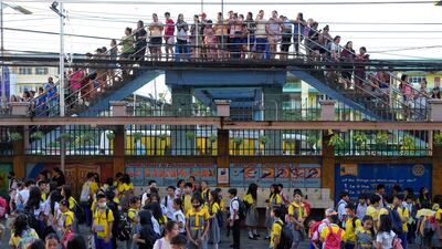 Parents and guardians outside an elementary school at the start of a new school year in Quezon City, Philippines. AP