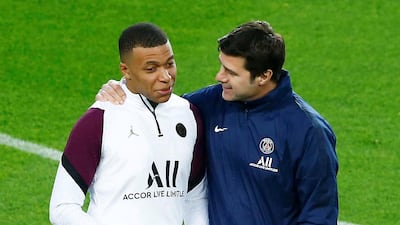 Paris Saint-Germain's manager Mauricio Pochettino with star striker Kylian Mbappe during a training session at Camp Nou ahead of the Champions League round of 16 first leg against Barcelona. EPA